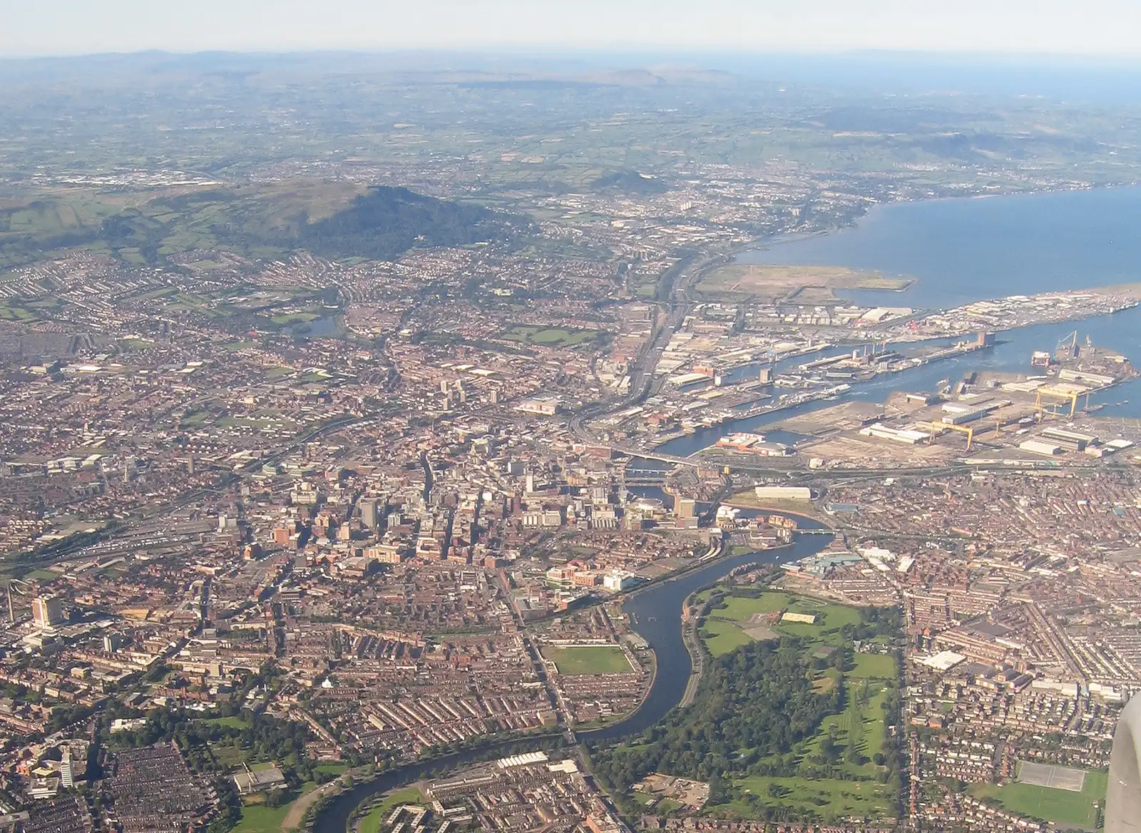 Aerial view of Belfast city centre, the River Lagan, the harbour and Cave Hill