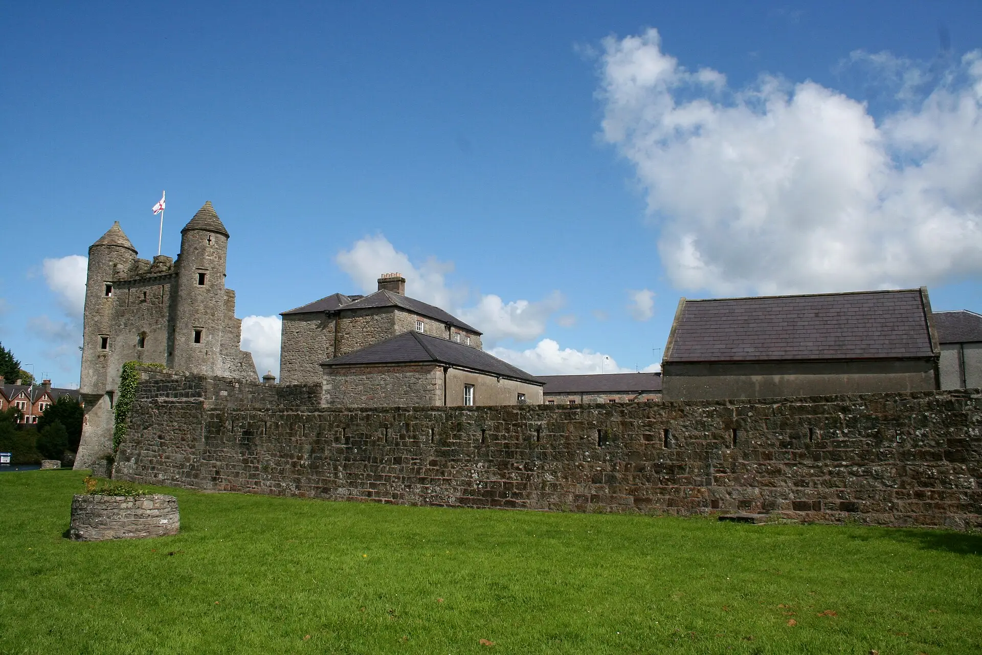 Enniskillen Castle and its curtain wall under a blue sky